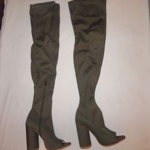 Medium high thigh high heels in the color olive